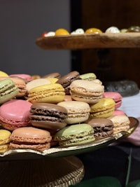 a tray of colorful macarons on a table