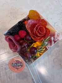 a box with fruit and meat in it